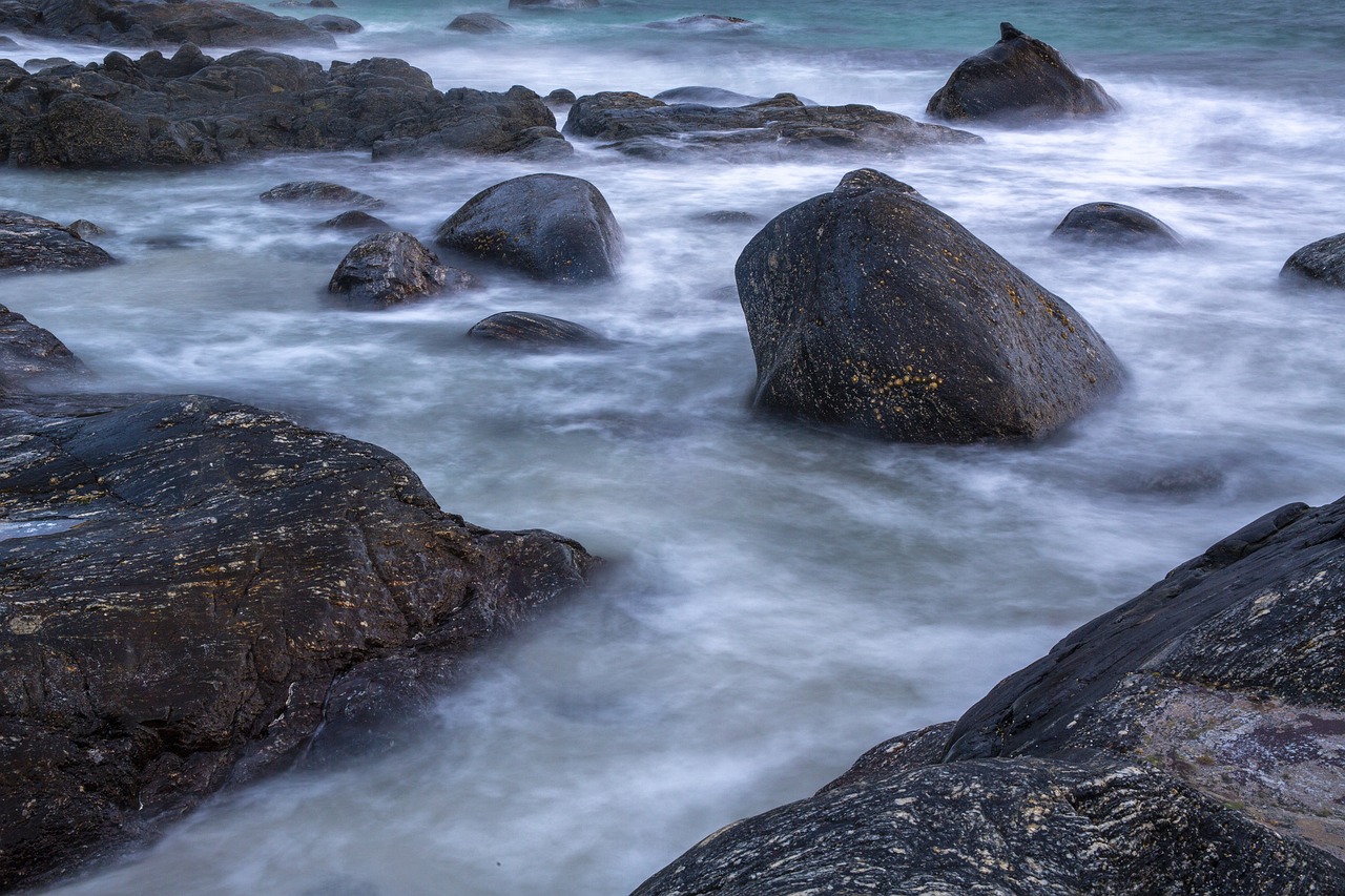 Ocean's Embrace Waves crashing against rocky shore